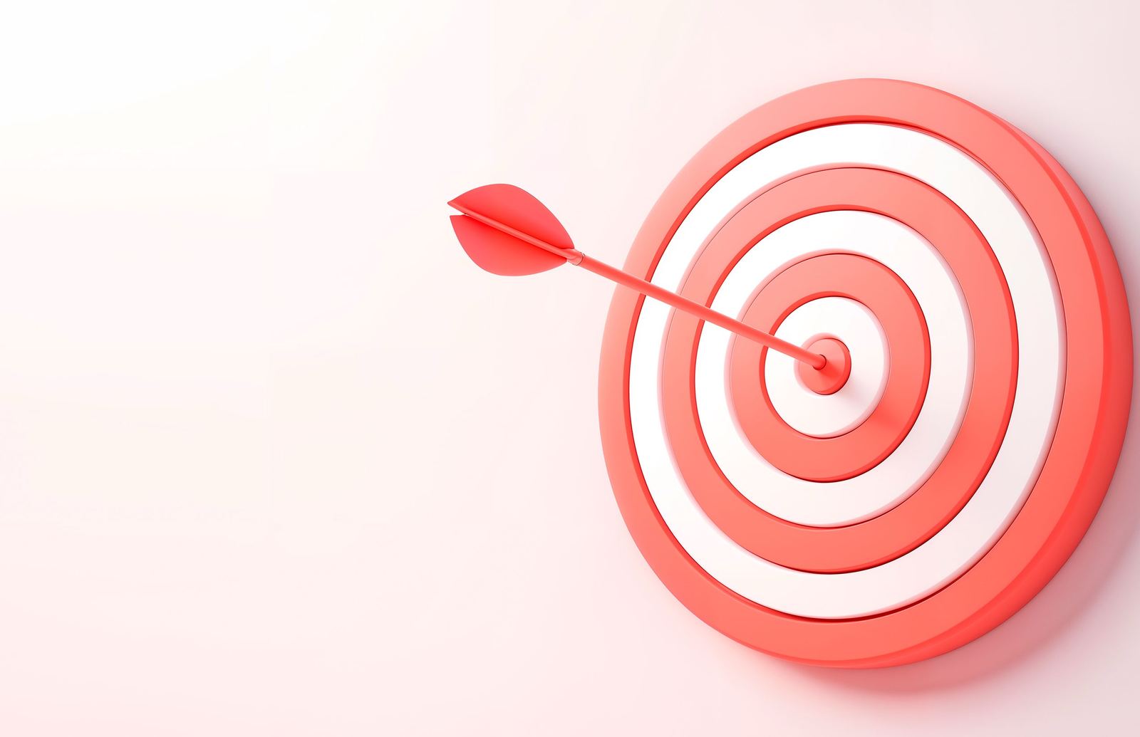 An arrow in the centre of a red and white target